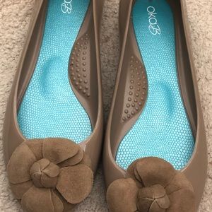 Tan ballet flats with suede flower toe